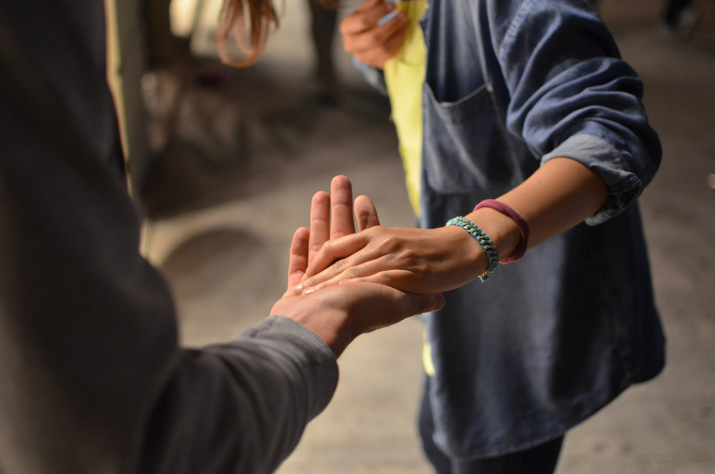 two people holding hands